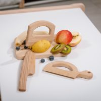 Chopping board with three knife set in a setting