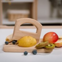 Chopping board with GRAB knife in a setting