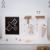 Toy tool box pieces on the work bench in white