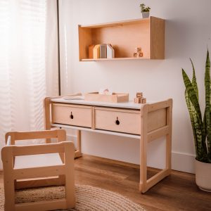 big bench in white as a desk with drawers in natural and a chair